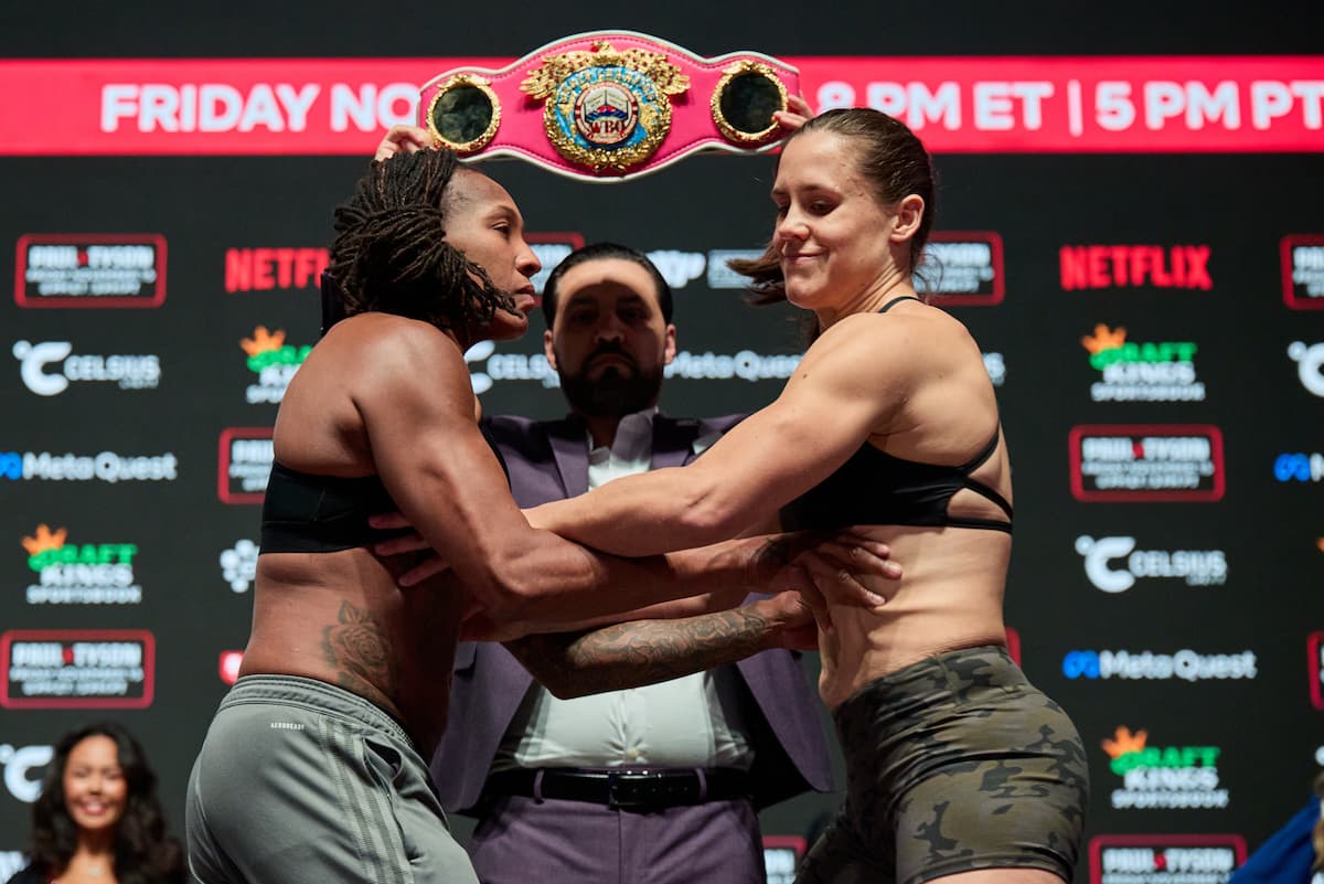 Shadasia Green and Melinda Watpool push each other at the weigh-ins