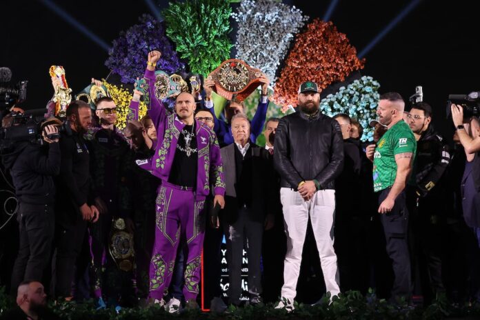 Oleksandr Usyk and Tyson Fury at the weigh-ins ahead of rematch