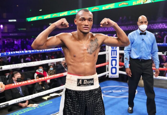 Boxer Alberto Puello poses after his victory