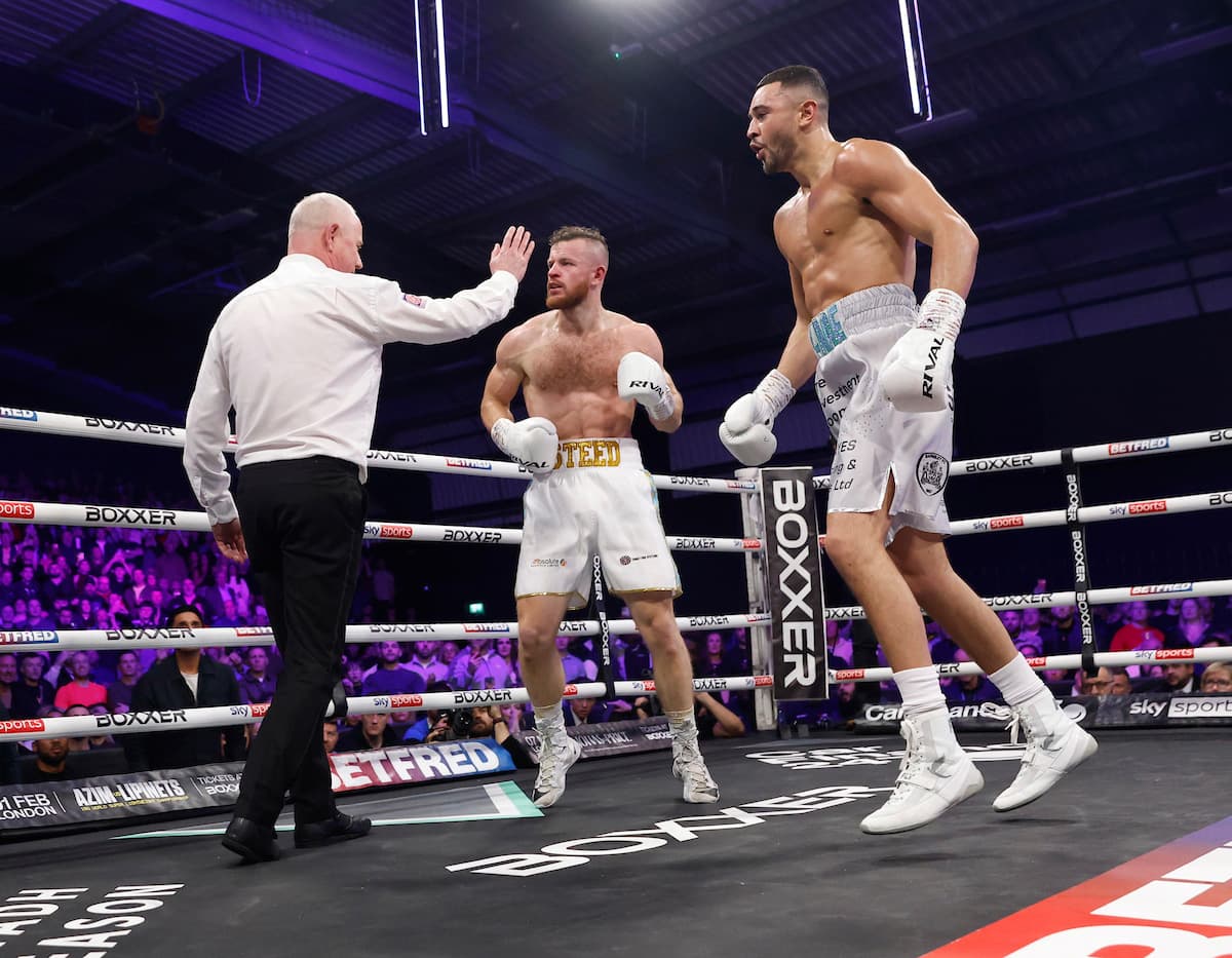 Referee Mark Bates stops the fight