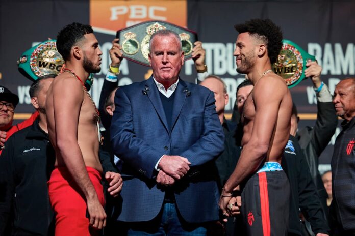 David Benavidez and David Morrell face each other at the weigh-in ahead of their boxing bout at T-Mobile Arena in Las Vegas