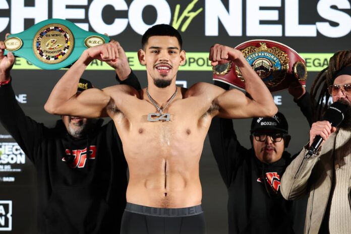 Boxer Diego Pacheco poses at the weigh-in ceremony ahead of his bout against Steven Nelson