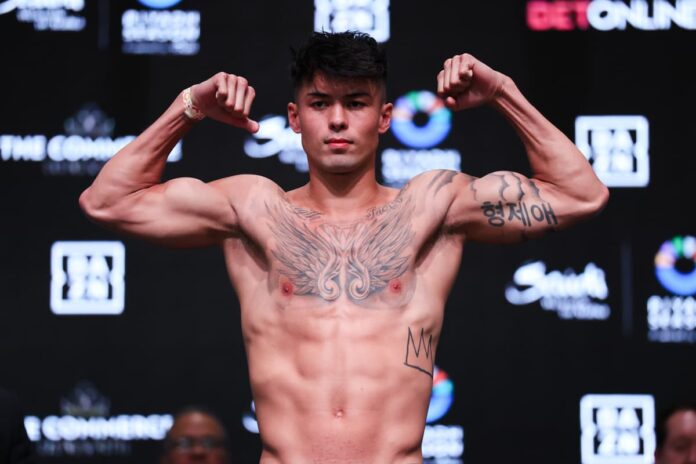 Eric Priest poses at the weigh-in ceremony ahead of his next bout