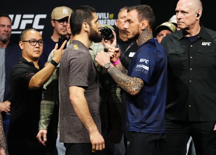 MMA fighters Islam Makhachev and Renato Moicano face each other at the UFC 311 weigh-ins