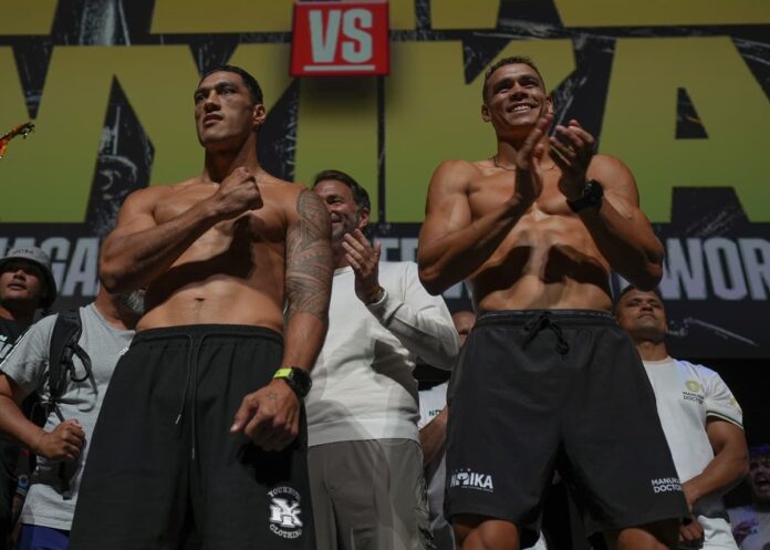 Jai Opetaia and David Nyika at the weigh-ins ahead of their title fight