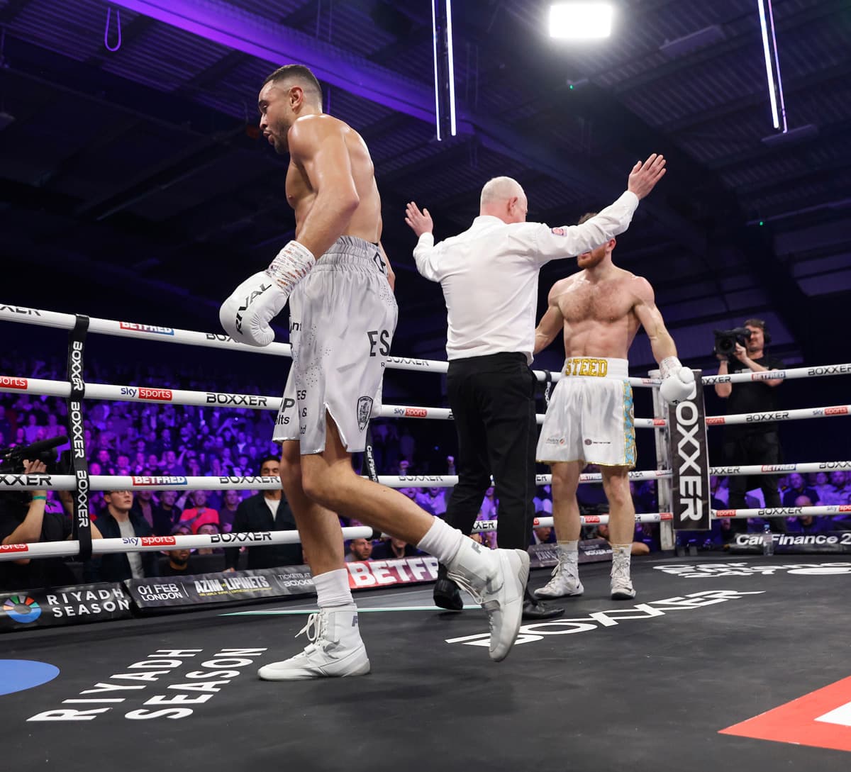 Referee Mark Bates waves the fight off