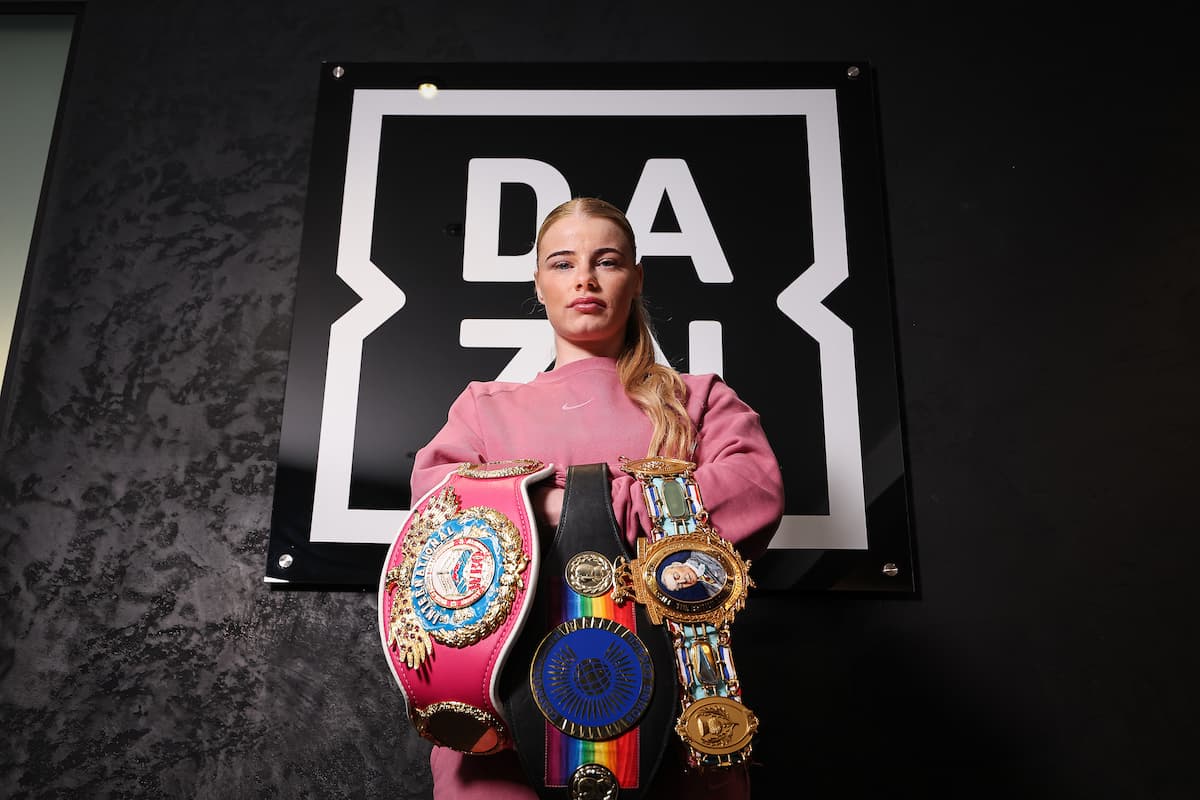 Tysie Gallagher poses with her championship belts