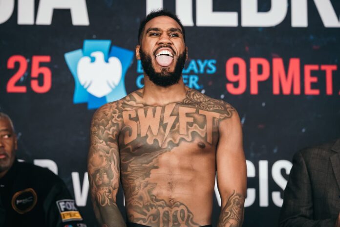 Jarrett Hurd poses at the weigh-in ahead of his boxing bout