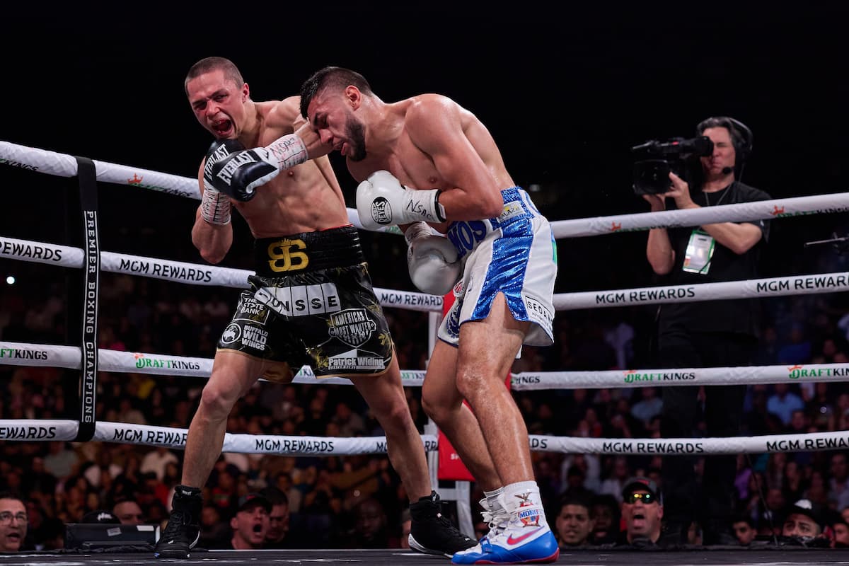 Joey Spencer punches Jesus Ramos during their boxing bout