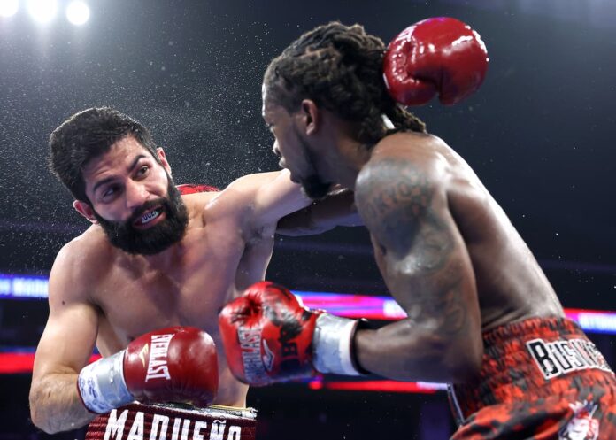 Miguel Madueno faces Keyshawn Davis during their boxing bout