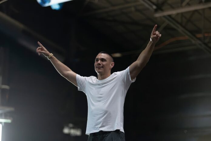 Tim Tszyu raises his hands promoting his upcoming bout against Joseph Spencer at the Newcastle Entertainment Centre in Broadmeadow, NSW