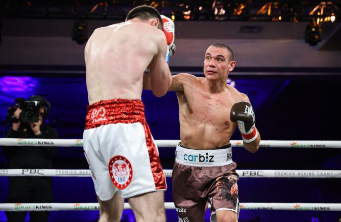 Tim Tszyu punches Bakhram Murtazaliev during their boxing bout