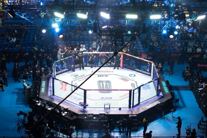 UFC Octagon set up in a venue for UFC 305, showcasing the iconic fighting stage