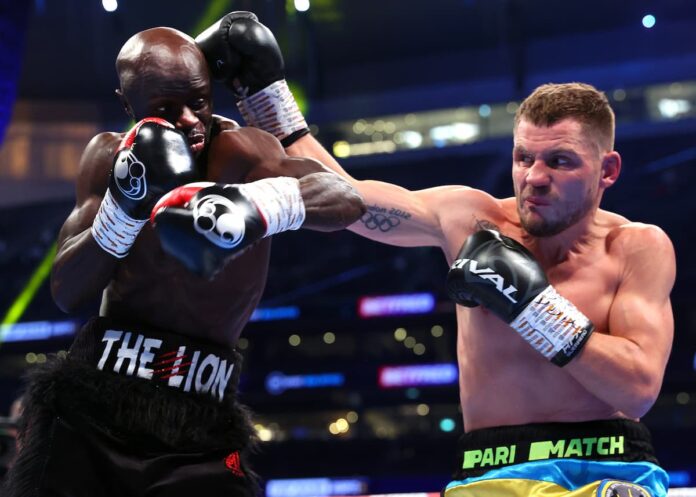 Denys Berinchyk punches Yvan Mendy during their boxing match