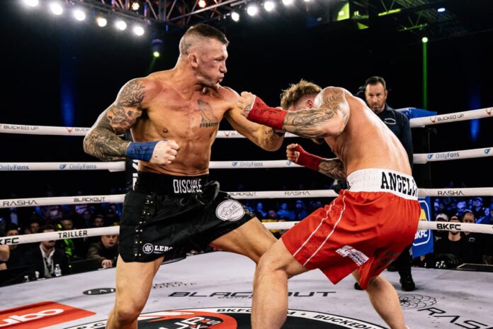 Dustin Pague punches Andrew Angelcor during the bare-knuckle boxing bout at BKFC Philly