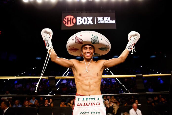 Freudis Rojas celebrates his victory after defeating Saul Bustos in their boxing match