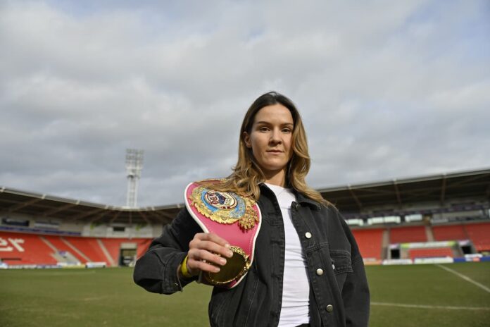 Terri Harper poses with her title belt at Eco-Power Stadium in Doncaster, England